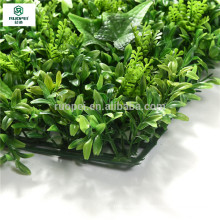 Green Vertical artificial mixed foliage mat for wall